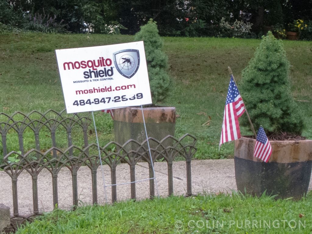 Mosquito Shield sign in yard