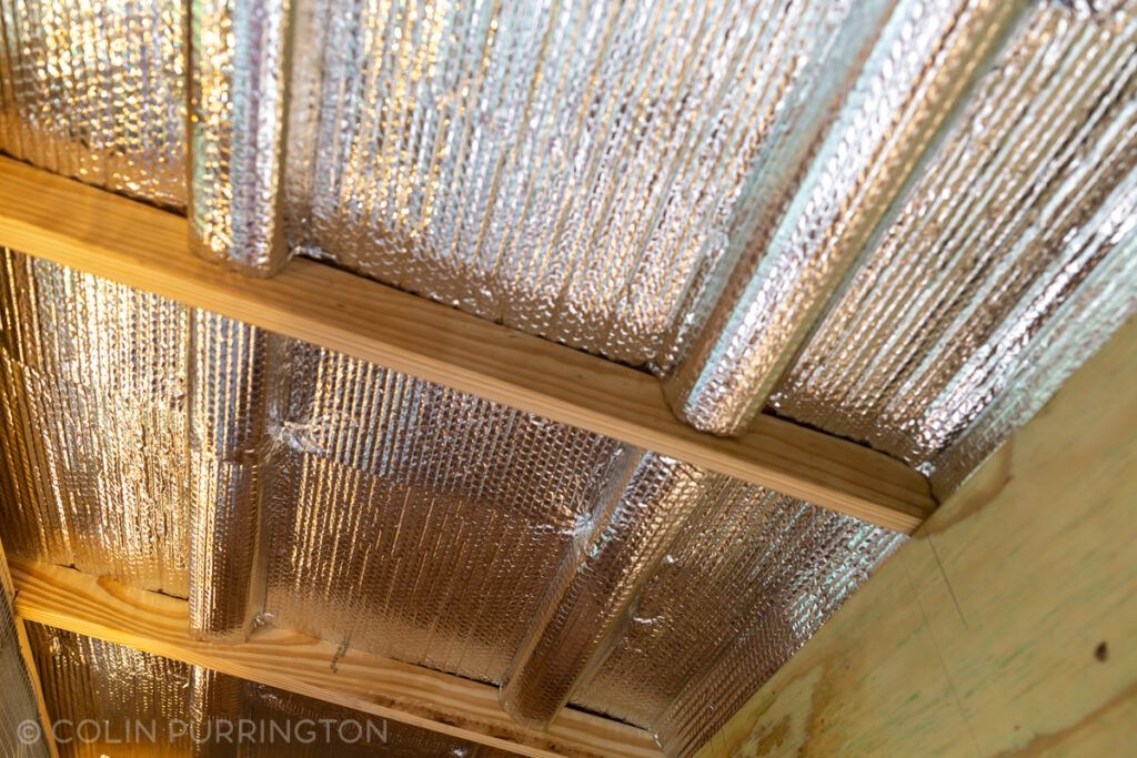 Reflective bubble insulation on ceiling of chicken coop